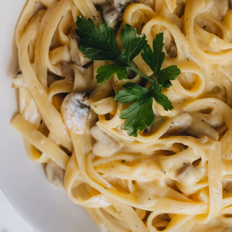 Creamy fettuccine topped with fresh parsley