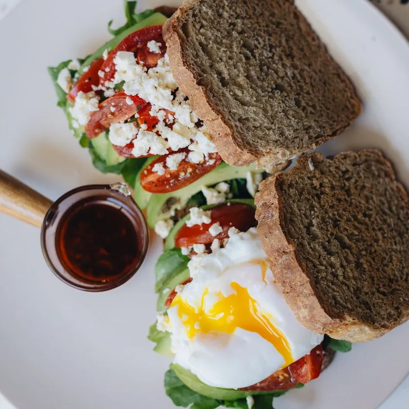 Rye open sandwiches with a poached egg and dips