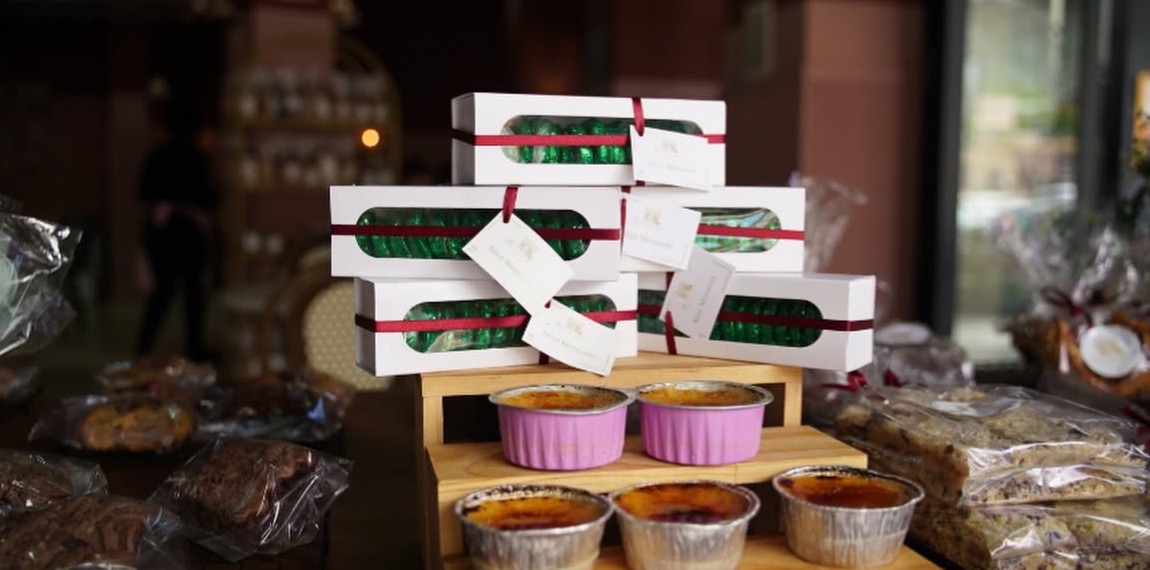 The counter at The Family Bakehouse, stacked with boxed treats and crème brûlée